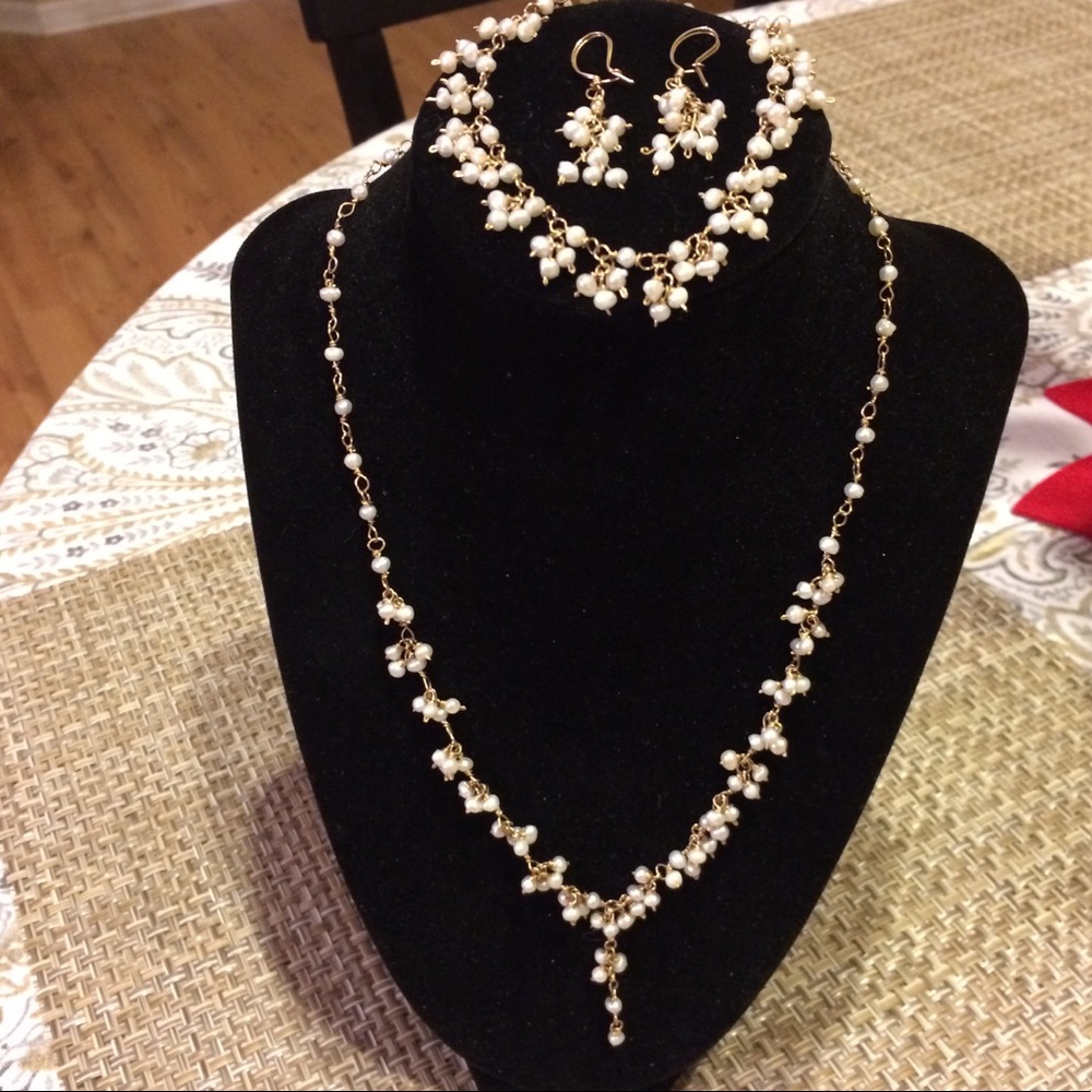 Pearl necklace, earrings and bracelet set. $350